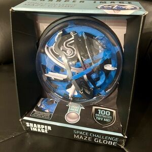 Sharper Image- space challenge maze globe. Brand new inbox. Perfect for a gift.